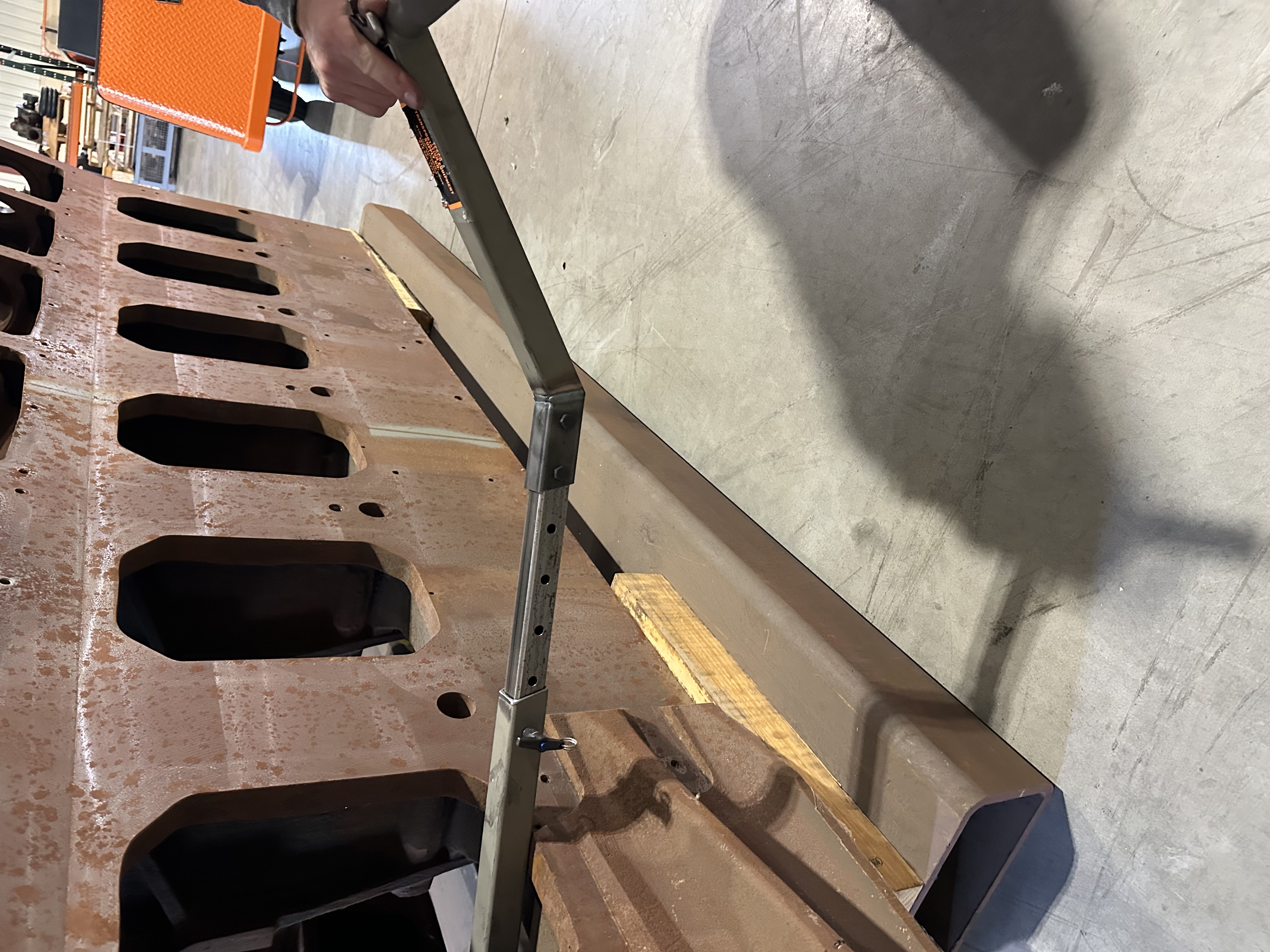 This is a new tensioner lifting arm to help guide the tensioners into place much faster and more efficiently. We have made some minor changes, so the arm could look a little different. 